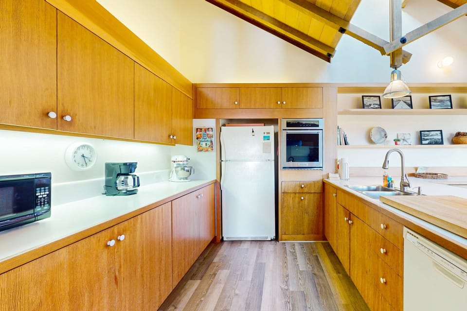 Create culinary delights in this well-appointed kitchen, where modern conveniences meet a welcoming, open layout.