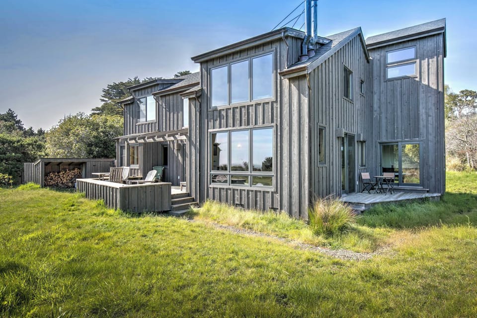 The Barn's exterior boasts a charming design, blending seamlessly with its surroundings, offering a warm welcome to your coastal retreat.