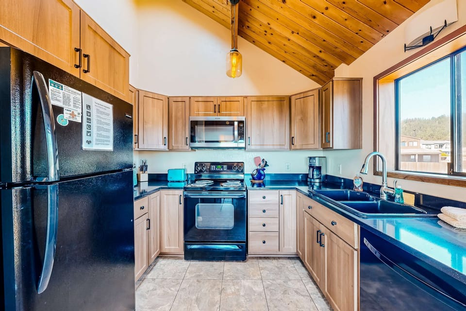 Embrace the joy of cooking in this stylish kitchen, designed for both convenience and connection with loved ones.