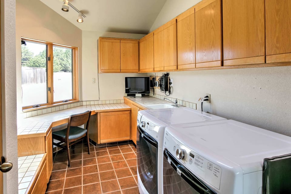 Functional laundry area is a convenient bonus for longer stays, ensuring you have everything you need for your coastal retreat.