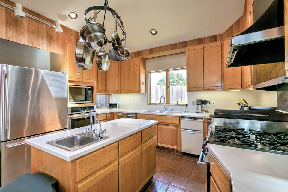 With modern appliances and ample counter space, this kitchen is ready for your culinary adventures, just steps from the dining area.