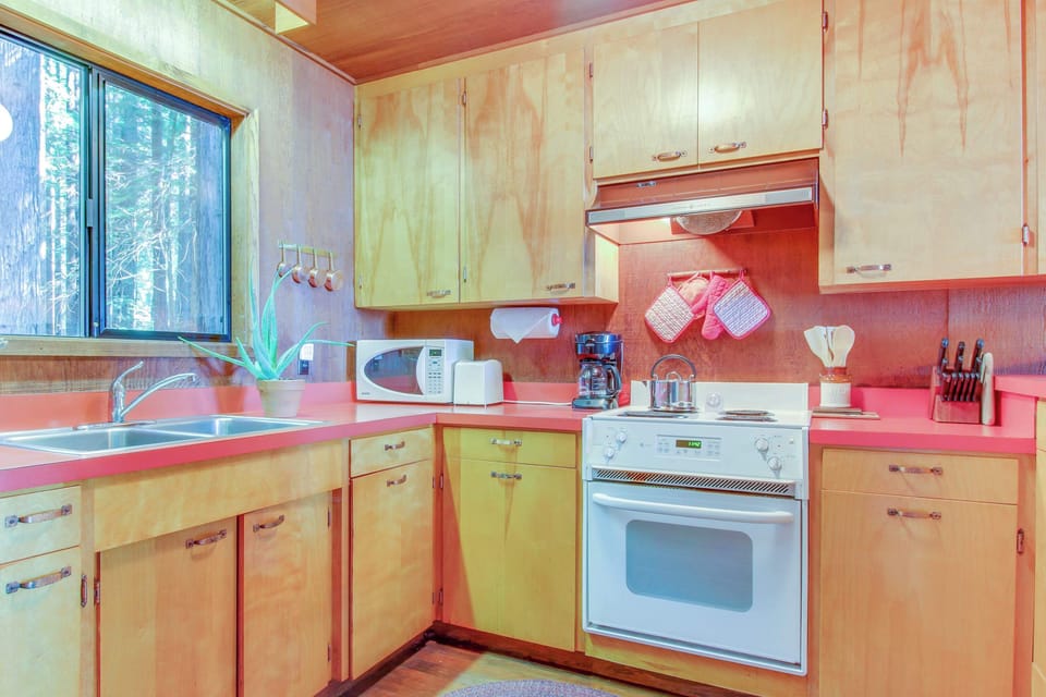 Cook up your favorite meals in this functional kitchen, where the warm tones and natural light inspire culinary creativity.