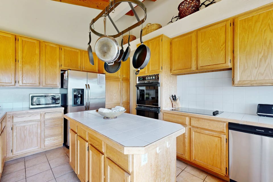 Preparing family meals at the spacious island is perfect for casual breakfasts and lively conversations.