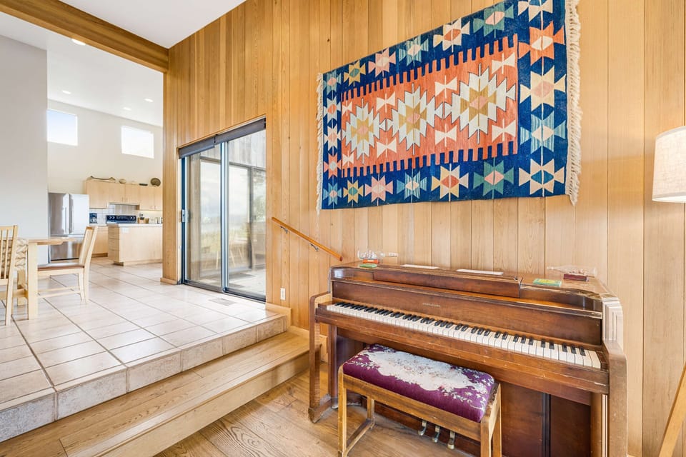 The unique decor adds character to the home, inviting you to sit at the piano and make music amidst the ocean backdrop.