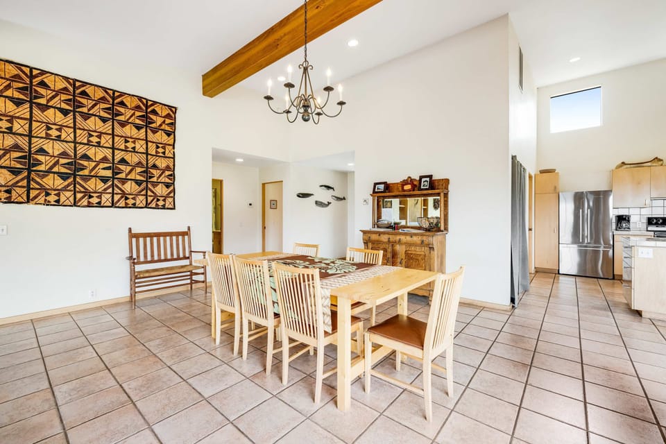 Gather around the dining table, where you can share delicious meals and create memories, all while enjoying the coastal ambiance.