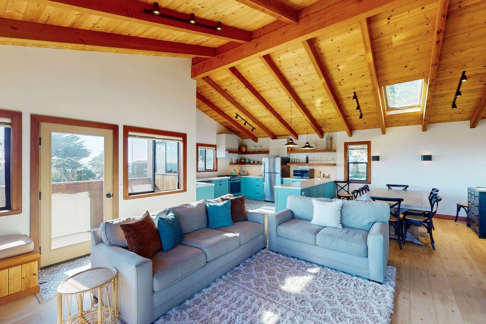Morning light fills the open living space, inviting you to relax on the plush sofas while enjoying views that stretch to the horizon.