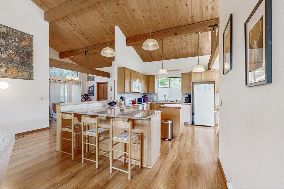 Craft your culinary delights in the spacious kitchen, featuring modern appliances and ample counter space for all your cooking adventures.