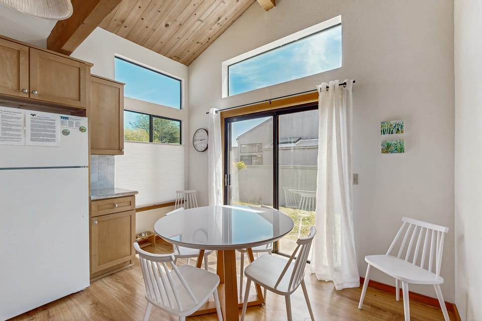 Enjoy your morning coffee in this charming dining nook, where natural light brightens every bite and sip.