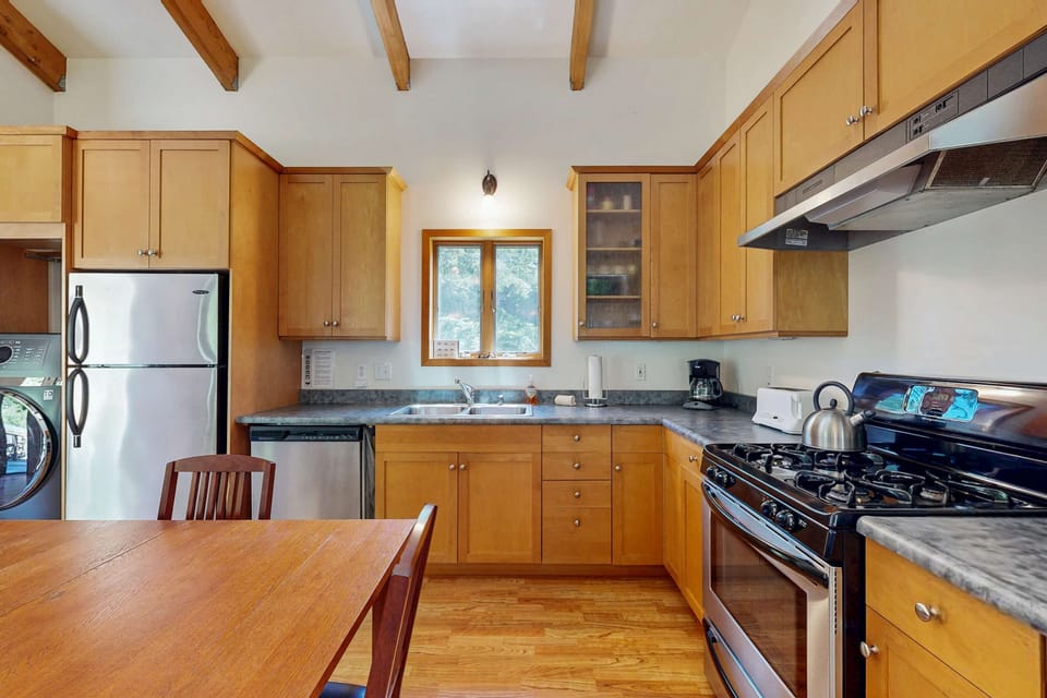 With ample counter space and modern appliances, the kitchen inspires you to whip up delicious dishes while soaking in the cozy ambiance.