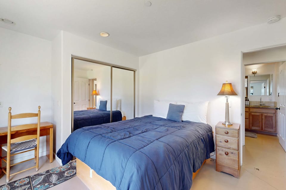 Your serene master bedroom awaits, offering a peaceful haven with inviting decor and easy access to a bathroom designed for ultimate relaxation.