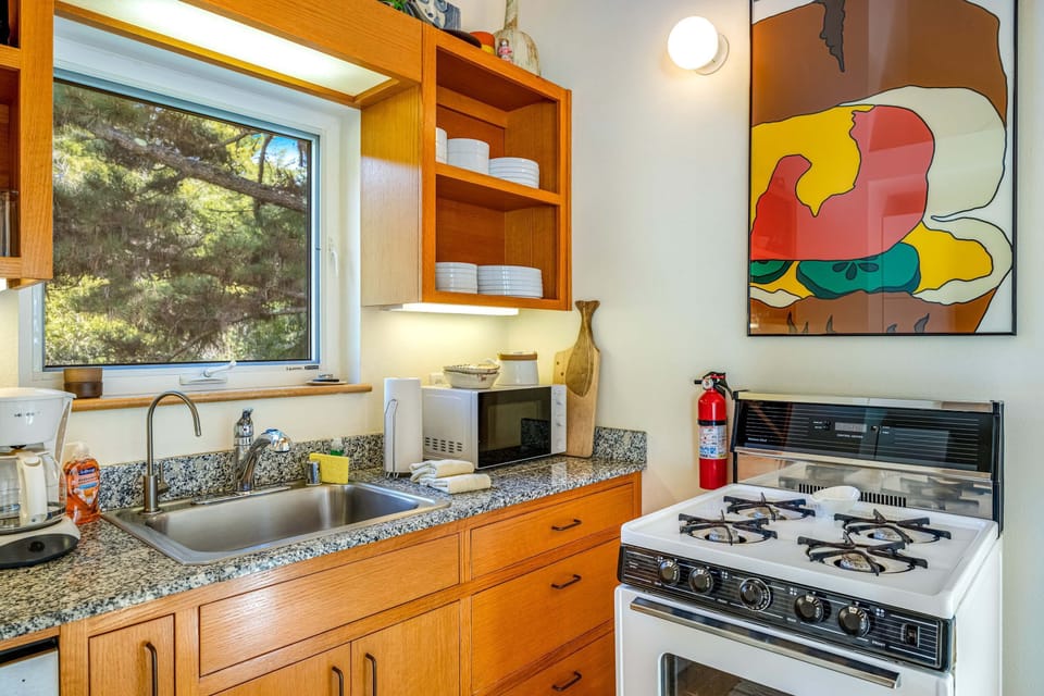 Enjoy effortless access to your private deck from the kitchen, making it easy to savor morning coffee in the fresh air.