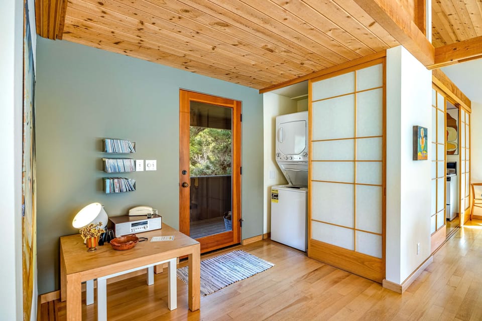 Convenience meets charm in this cozy entryway, featuring easy access to laundry and a welcoming atmosphere as you arrive.