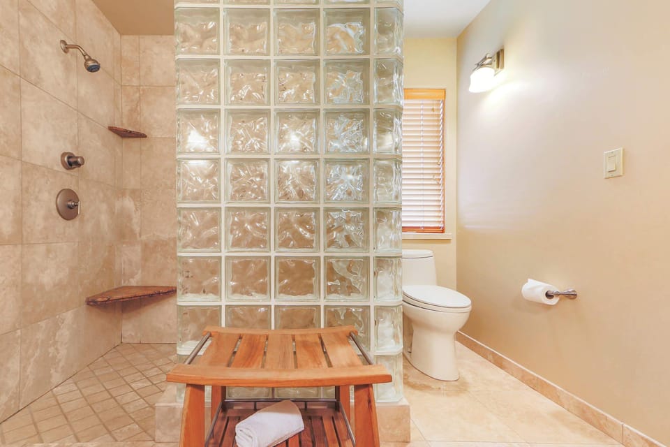 Revitalize in this elegant bathroom, where a spacious shower and luxurious finishes provide a serene retreat for your daily refresh.
