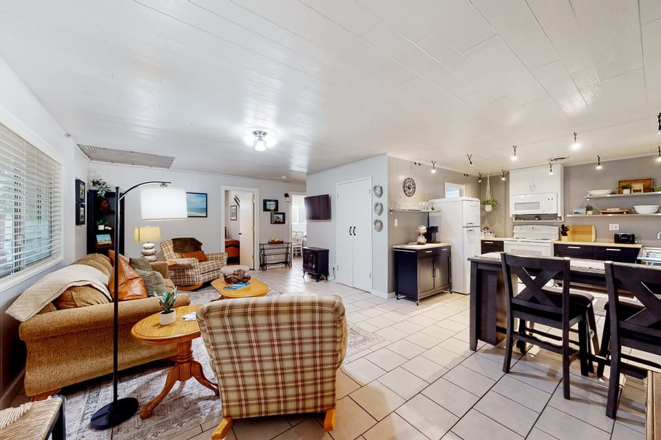 Feel at home in the inviting living room, perfect for cozy evenings with loved ones or a good book by the fire.