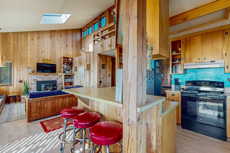 Cook up your favorite meals in this well-equipped kitchen, featuring a functional layout that makes meal prep a breeze while you soak in the coastal vibes.