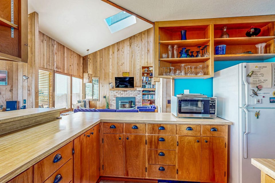 Experience the joy of cooking in this bright kitchen, complete with modern appliances and ample counter space, perfect for family feasts and morning coffee.
