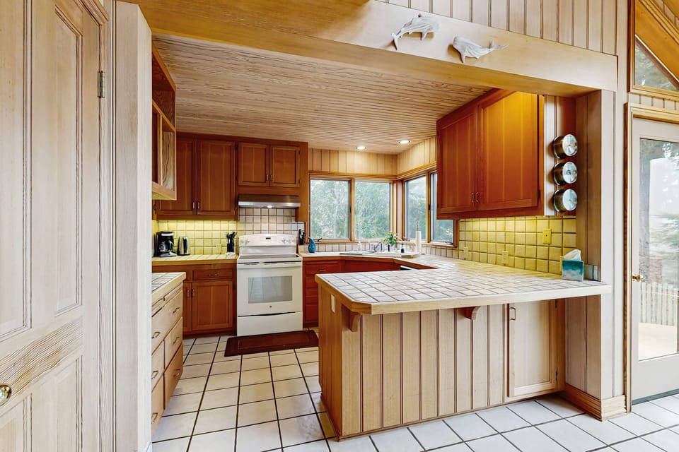 Unleash your culinary creativity in this well-equipped kitchen, designed for both casual cooking and special family feasts.