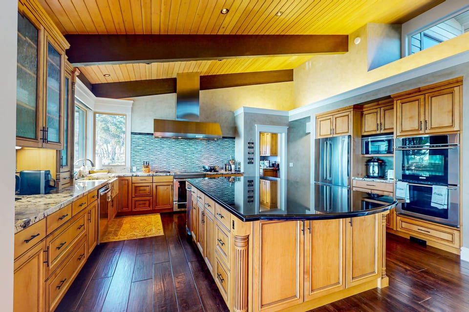 Whip up your favorite meals in this stunning kitchen, where ocean views and elegant finishes inspire culinary creativity.