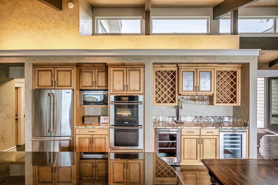 Enjoy the convenience of modern appliances and elegant finishes in this well-appointed kitchen, perfect for family gatherings.