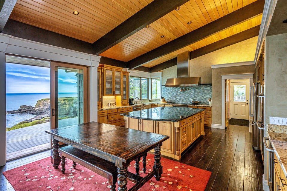 Create culinary delights in this gourmet kitchen, where the ocean view inspires your cooking and the spacious layout invites joyful gatherings.