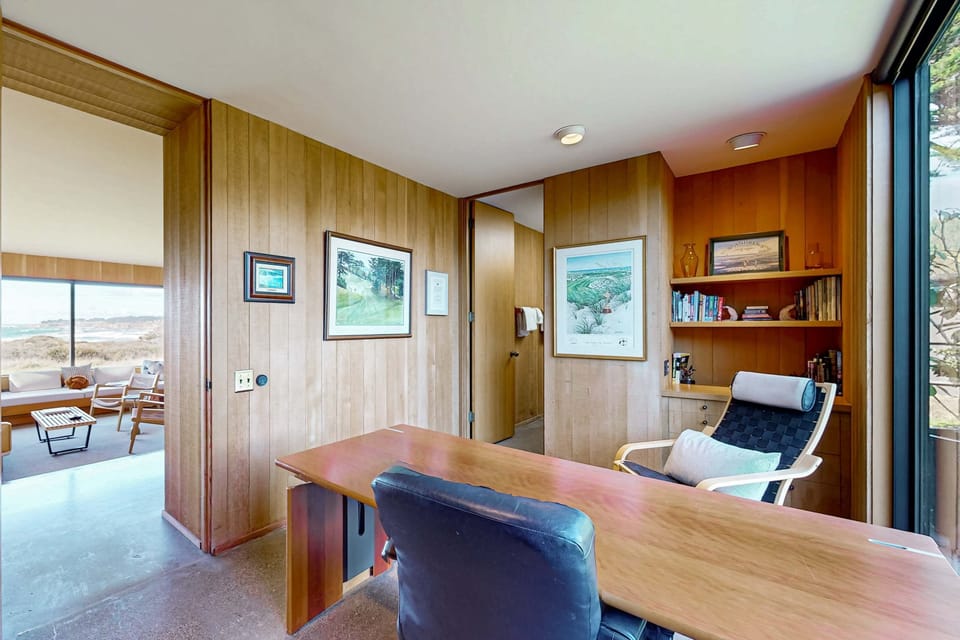 Create your dream workspace in this serene study, where natural light and ocean views enhance productivity and relaxation.
