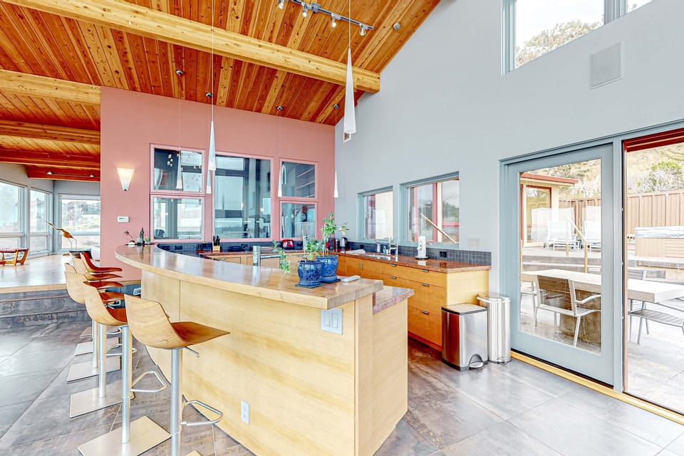 Cook up culinary delights in a spacious kitchen designed for both functionality and oceanfront views, making meal prep a pleasure.