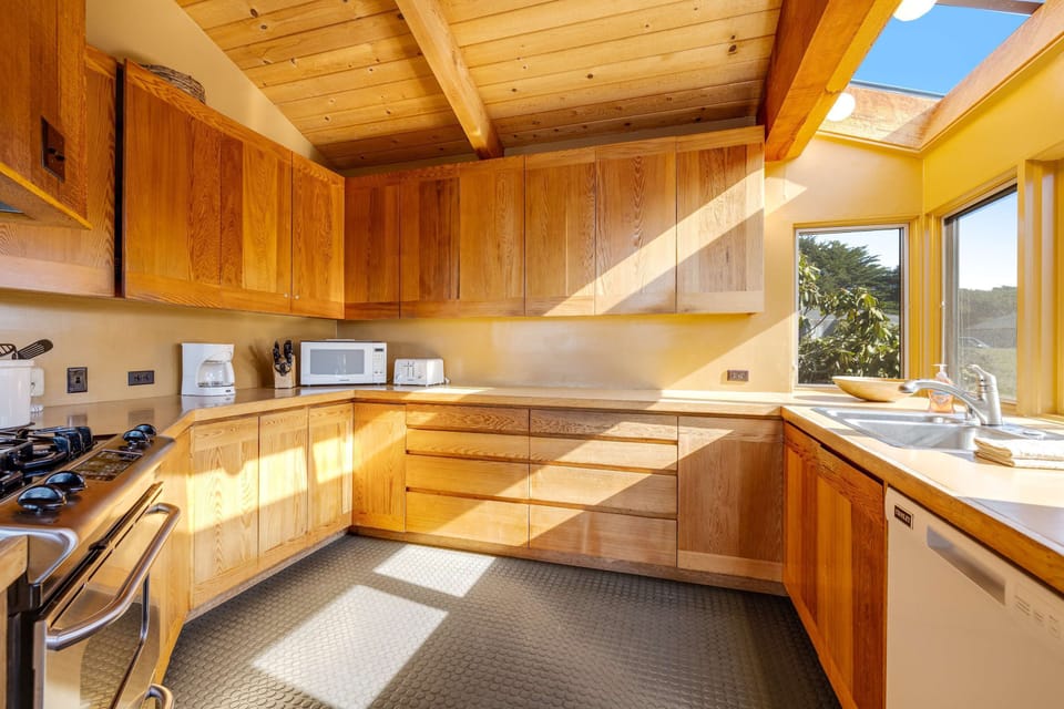 Craft delicious meals surrounded by beautiful wood finishes, with easy access to the dining area for seamless entertaining.