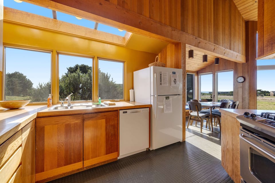 Bright and airy, this kitchen features a stunning view that makes every cooking experience feel refreshing and invigorating.