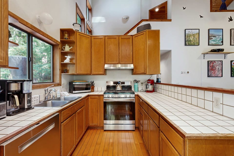 Craft delicious meals in this well-appointed kitchen, where ample counter space and natural light enhance your cooking experience.