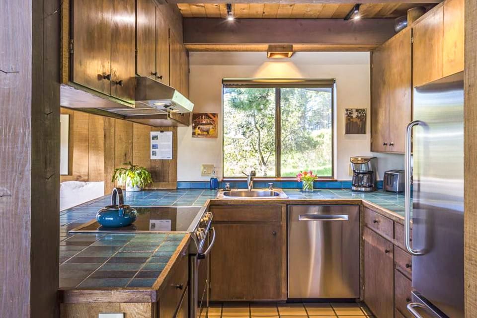 Whip up gourmet meals in this bright kitchen, designed for both functionality and style, with views that keep you connected to nature.