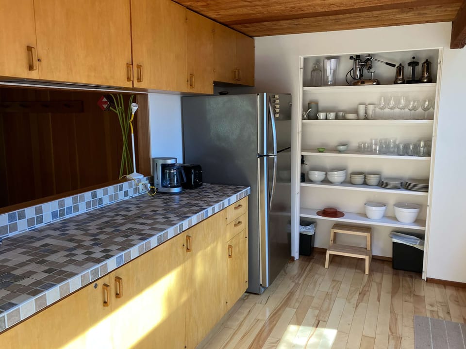 A bright, functional kitchen awaits, featuring ample storage and a design that inspires culinary creativity.