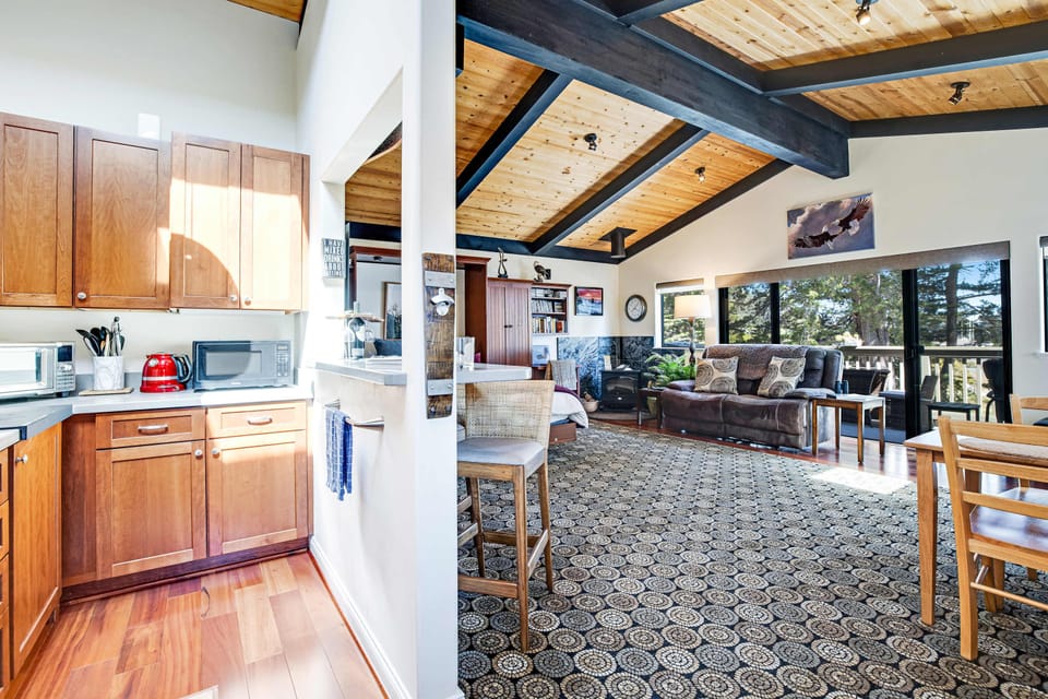 This spacious living area welcomes you with natural light and a warm, open feel, perfect for gathering with loved ones after a day of adventure.