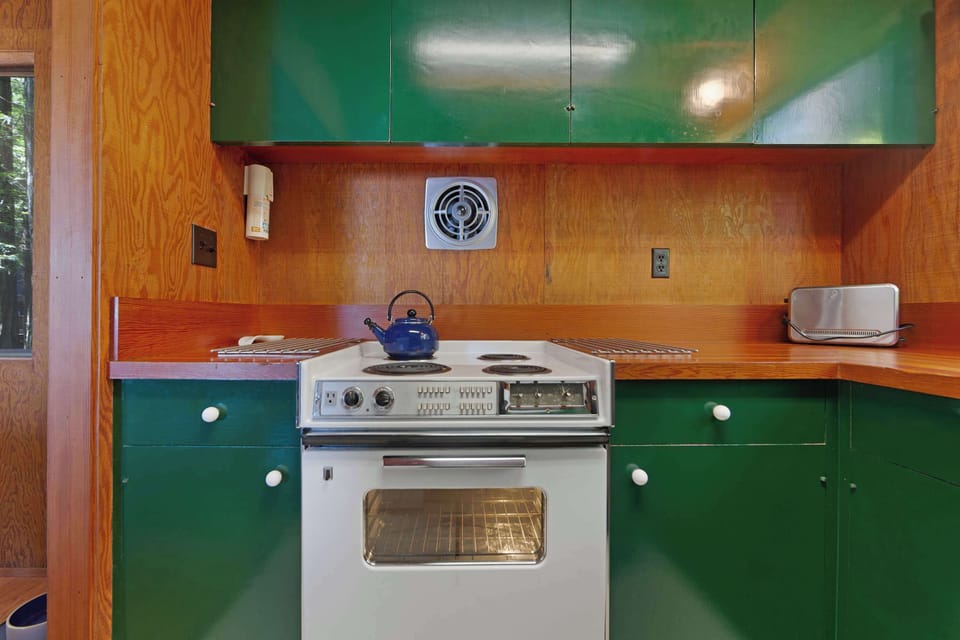 With ample counter space and modern appliances, this kitchen invites you to savor the joy of cooking while surrounded by the beauty of the redwoods.