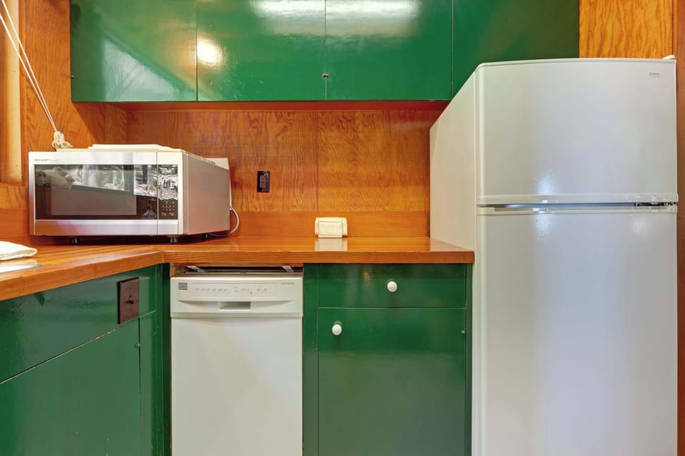 Experience the convenience of a full kitchen, perfect for preparing everything from quick snacks to gourmet dinners in your cozy cabin retreat.