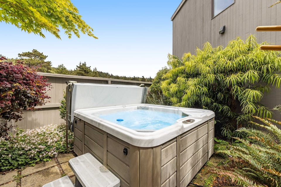 Soak away your cares in the private hot tub, surrounded by lush greenery and the peaceful sounds of nature.