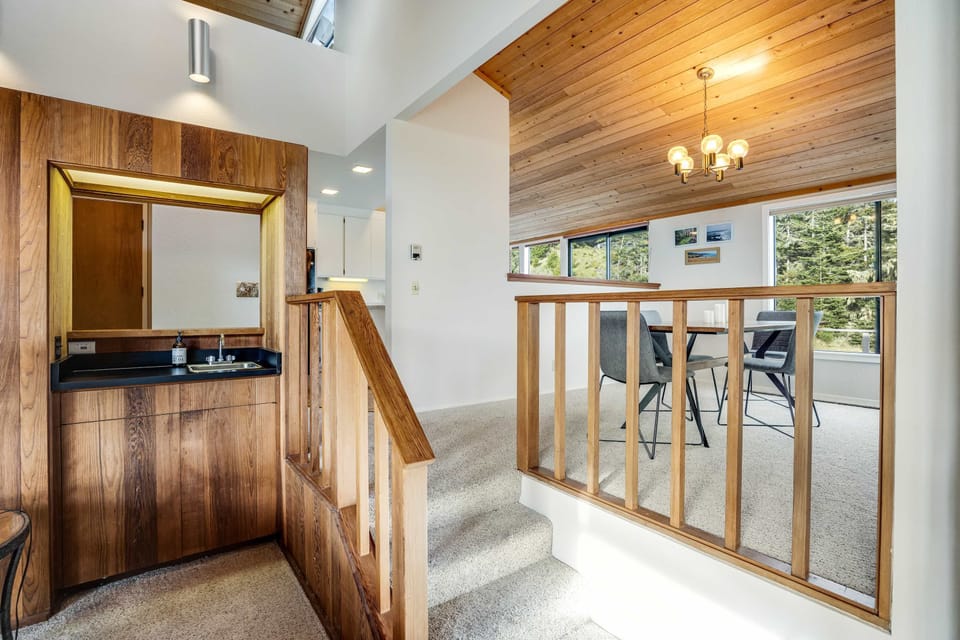 A stylish entryway welcomes you with warm wood accents, setting the tone for your relaxing retreat.