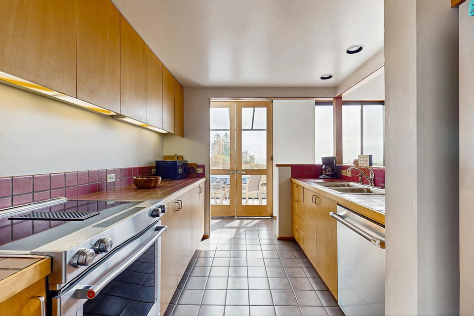 Embrace your inner chef in this modern kitchen, where expansive counters and natural light enhance your culinary creations.