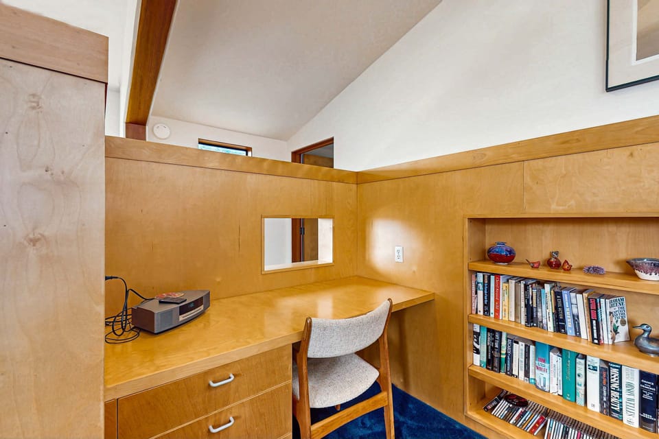 This dedicated workspace invites productivity, with a comfortable desk and bookshelves to inspire your creativity during your stay.