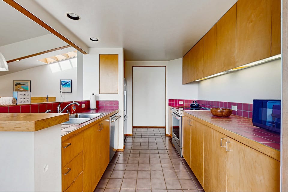 Cook up a feast in this well-equipped kitchen, designed for effortless meal preparation and socializing with family and friends.