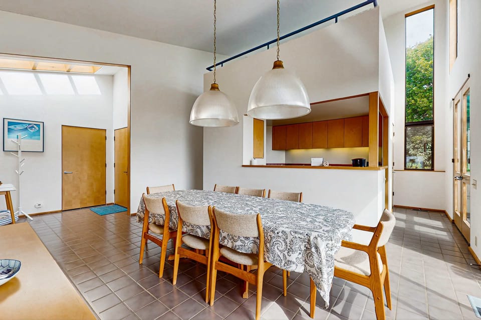 Let the sun stream in as you share stories over breakfast at this inviting dining space, perfect for both intimate meals and celebrations.