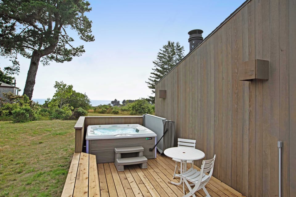 Step into your private hot tub and soak in the tranquility, surrounded by nature and ocean breezes.