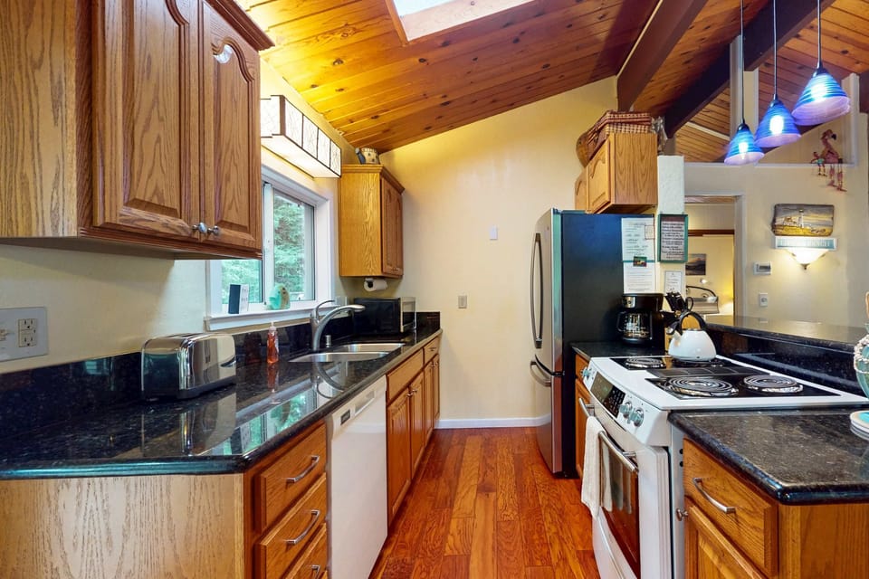Whip up delicious meals in this stylish kitchen, where modern amenities meet cozy charm, making cooking a joy.