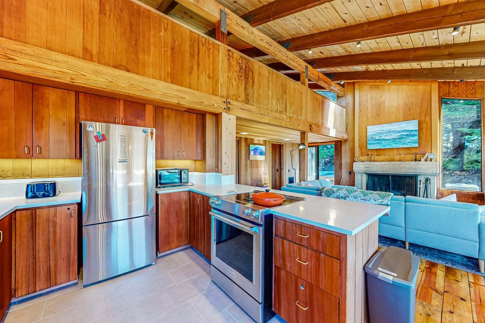 Experience culinary delights with modern appliances in this inviting kitchen, perfect for family gatherings.
