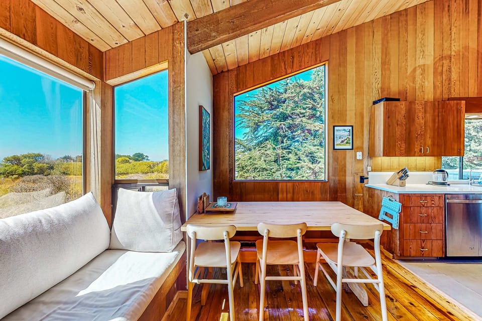 Elevate your mornings with coffee by the fireplace in this inviting lounge, where warmth and comfort await.