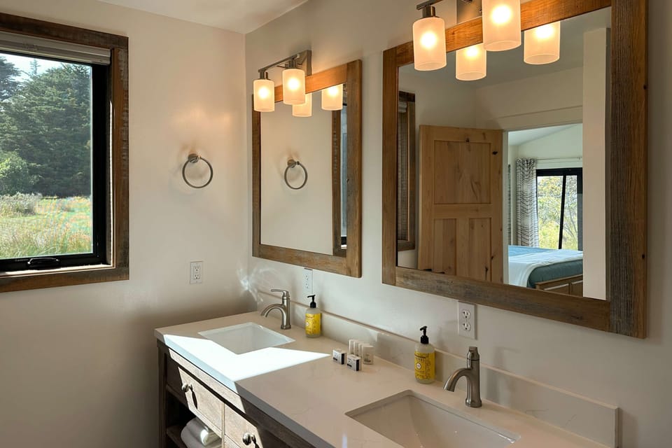 Refresh in this stylish bathroom, where natural light and modern fixtures create a serene atmosphere for your daily routine.