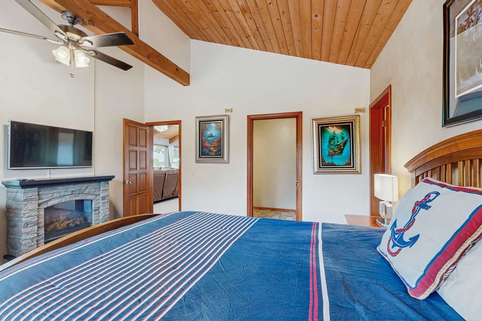 The master bedroom is your sanctuary, where rustic charm meets coastal style, ensuring a restful night in a serene setting.