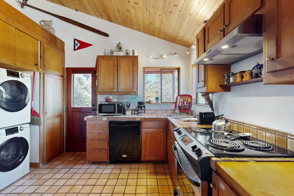 Equipped with modern appliances, this kitchen is perfect for whipping up snacks before heading out to explore the coastline.