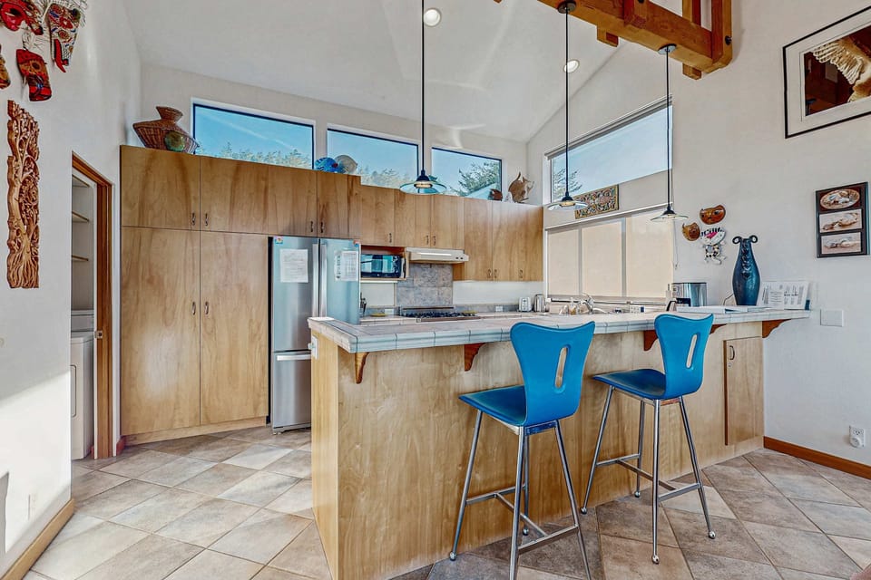 Unleash your culinary creativity in the well-equipped kitchen, designed for both cooking and entertaining.
