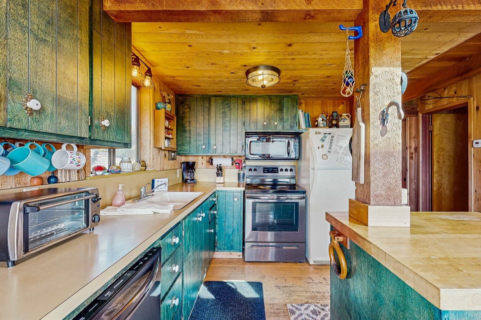 Whip up delicious meals in this charming kitchen, designed for culinary adventures with a view that inspires creativity.