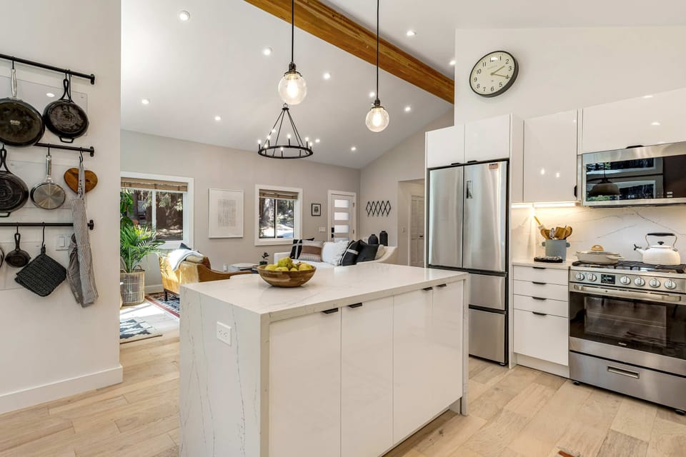 Experience the joy of cooking in a spacious kitchen, where modern amenities meet the charm of a woodland retreat.